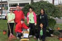 Paramount PT staff participating in PT Day of Service by planting gardens along Sunrise Plaza